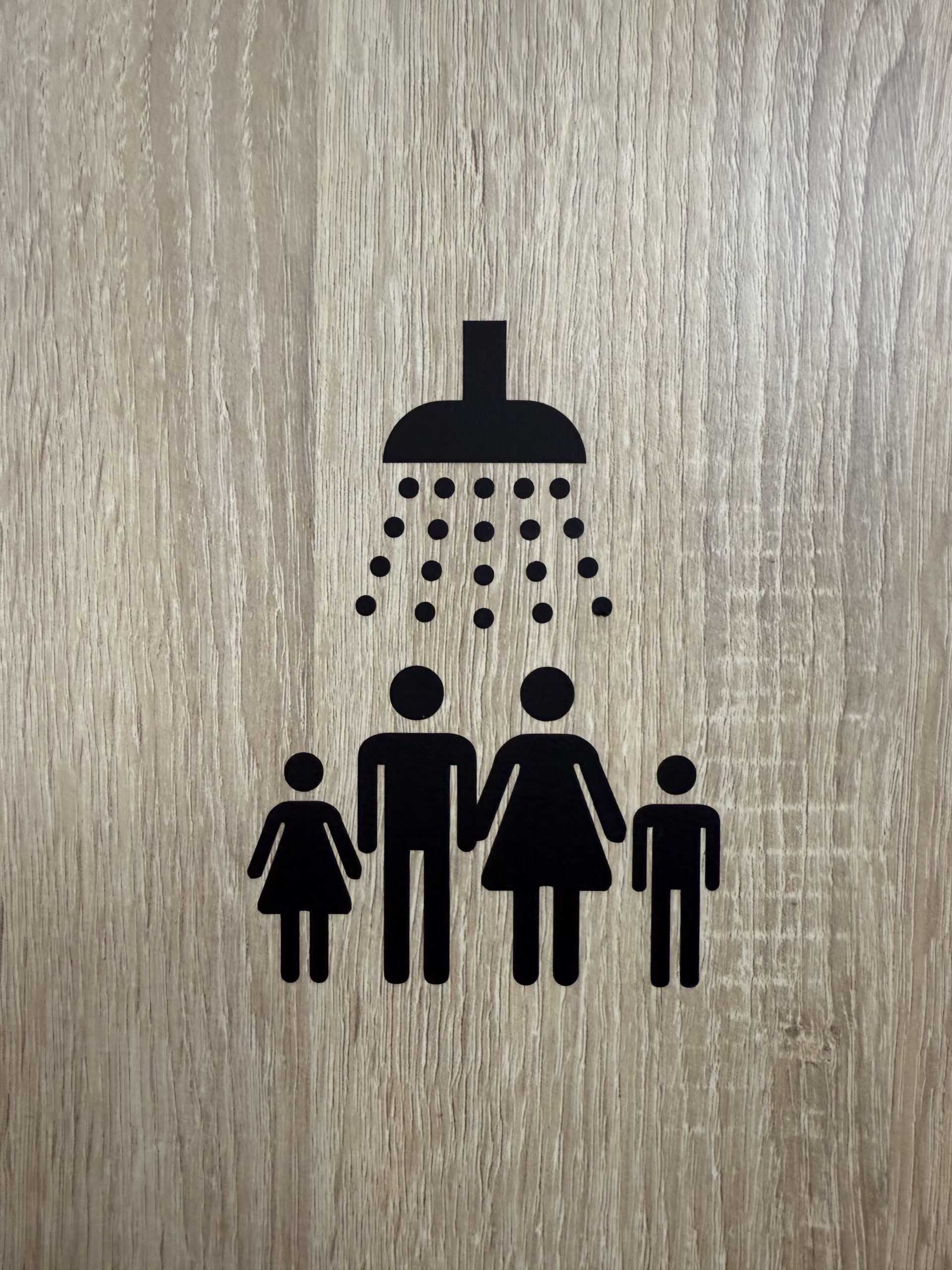 Pictogram op deur van familiedouche